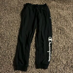 Black Champion sweatpants, white lettering.